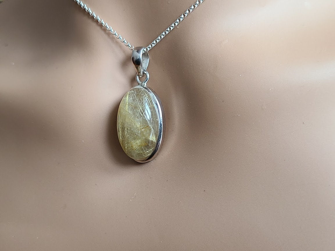 Rutilated quartz pendant set in 92.5 sterling silver